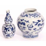 19th century Chinese bulbous vase decorated in underglaze blue with a sinuous dragon chasing the