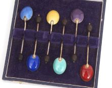 Cased set of six George V silver and enamelled coffee spoons, each with a coffee bean finial to a
