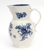 18th century Caughley cabbage leaf mask jug painted in underglaze blue with floral sprays, 23cm high