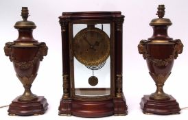 Early 20th century mahogany and cast brass four-glass clock garniture, the serpentine fronted case