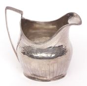 George III cream jug of helmet form with applied reeded border and handle (top handle mount and base