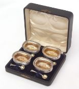 Cased set of four Edward VII open salts each of oval form with half-fluted bodies, gilt lined