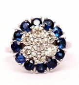 18ct white gold, diamond and sapphire cluster ring a centre of seven brilliant cut diamonds raised