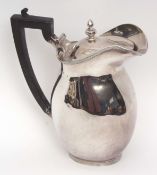 Edward VII lidded ewer of plain polished oval baluster form with hinged and domed cover, height 20