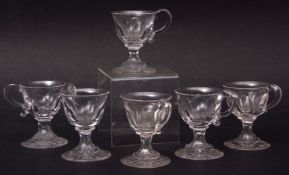 Set of six 19th century glass custard cups, faceted bodies, waisted stems and star cut bases, 9cm