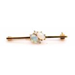 18ct gold, opal and diamond bar brooch featuring two oval cut opals flanked by two small brilliant