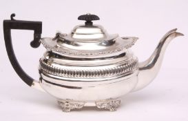 Edward VII tea pot of oval form with hinged and domed cover, cast and applied flared rim and