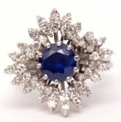 Precious metal, sapphire and diamond cluster ring, the central round cut sapphire 1.5ct approx,