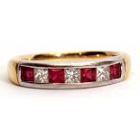 An 18ct gold, princess cut ruby and diamond half-eternity ring featuring three princess cut diamonds