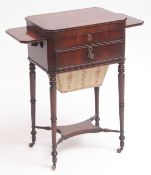 Early 19th century mahogany work/writing table of canted rectangular form, the lifting lid enclosing