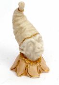 Late 19th century Grainger Worcester candle snuffer modelled as a monkey's head wearing a circus hat