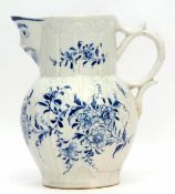 Rare Lowestoft jug, the moulded body decorated with floral sprays with a mask spout, the mask