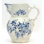 Rare Lowestoft jug, the moulded body decorated with floral sprays with a mask spout, the mask