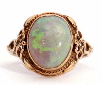 Late 19th/early 20th century opal ring, the cabochon oval shaped opal 12 x 10mm collet set between