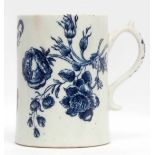 Lowestoft mug with scroll handle decorated in underglaze blue with floral prints and butterflies,