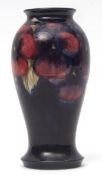 Mid-20th century Moorcroft baluster vase in the Pansy pattern on a blue ground, factory mark and