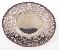 Chinese white metal table bowl with cast and applied rim to a heavily pierced floral and foliate