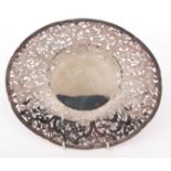 Chinese white metal table bowl with cast and applied rim to a heavily pierced floral and foliate