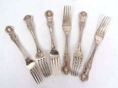 Six early Victorian Kings Honeysuckle pattern dinner forks with Union shell heels, crested with