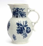 18th century Worcester cabbage leaf moulded mask jug decorated in underglaze blue with floral