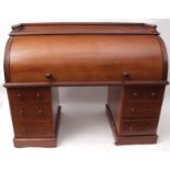 Victorian mahogany large cylinder desk, galleried top over a fitted interior with drawers,