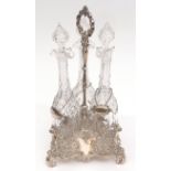 Late 19th century electro-plated decanter stand of triform base with scrolling supports and