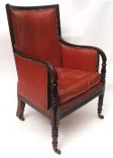 Early 19th century mahogany library chair, curved back and splayed arms, reeded edge, the arms each