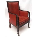 Early 19th century mahogany library chair, curved back and splayed arms, reeded edge, the arms each