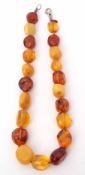 Vintage amber bead coloured necklace, a single row of slight graduation, various colours include egg