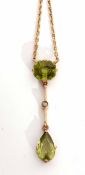 Early 20th century peridot and seed pearl pendant necklace featuring a cushion shaped peridot