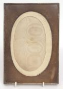 Edward VII silver mounted photograph frame, plain and polished mount and oval mask on a fabric
