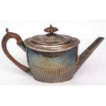 George III oval tea pot of half-fluted form with hinged and domed cover and treen handle and finial,