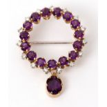 Amethyst and diamond brooch, designed as an openwork circular wreath, alternate set with small