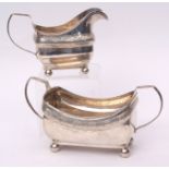 George III Irish sugar basin and milk jug, each of open rectangular form with reeded handles and