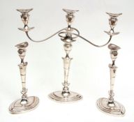 19th century silver on copper three-piece candelabra set comprising a single three-light