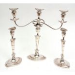 19th century silver on copper three-piece candelabra set comprising a single three-light