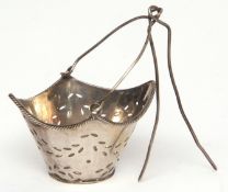 Dutch tea strainer modelled in the form of a shaped oval pail with applied rope twist rim and