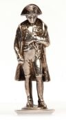 Late Victorian Continental cast model of a standing Napoleon on a circular base, height 7.8cm,