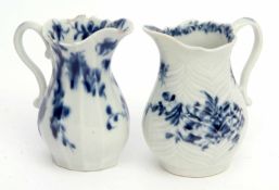 Two 18th century Worcester cream jugs decorated with the feather moulded floral pattern, workman's