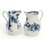 Two 18th century Worcester cream jugs decorated with the feather moulded floral pattern, workman's