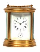 Late 19th century French gilt and lacquered brass oval carriage alarm clock, with push repeat,