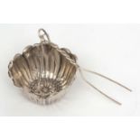 Late 19th century American tea strainer, the bowl modelled in the form of a flower with pierced