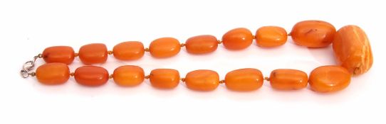 Amber bead necklace, a single string necklace with 17 individually knotted oblong beads, graduated