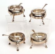 Four George III cauldron salts of plain polished form and raised on three cast and applied hoof feet