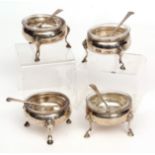 Four George III cauldron salts of plain polished form and raised on three cast and applied hoof feet