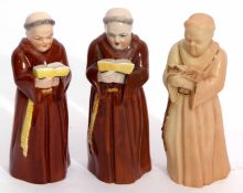 Group of three early 20th century Royal Worcester candle snuffers modelled as monks, one blush