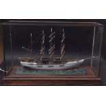 Painted model of a three-masted schooner within a glazed display case, 96cm long