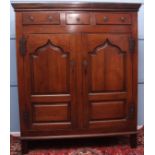 18th century oak housekeeper's cupboard, moulded top over three drawers, two panelled doors below