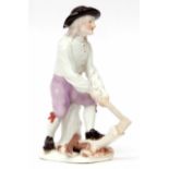 Mid-18th century Meissen figure of a woodcutter, modelled by J Kandler, the figure modelled chopping