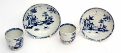 Two Lowestoft porcelain cups and saucers, both decorated with the long fence pattern